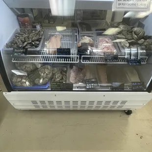 a display case full of raw fish