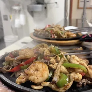 Texas fajitas. Served with rice, beans, lettuce, sour cream, pico, and guacamole.