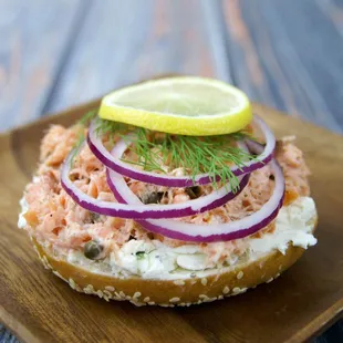 Kippered salmon salad sandwich on a sesame bagel.