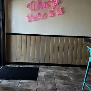 a neon sign in a restaurant