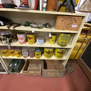Vintage oil cans. They are still sealed.