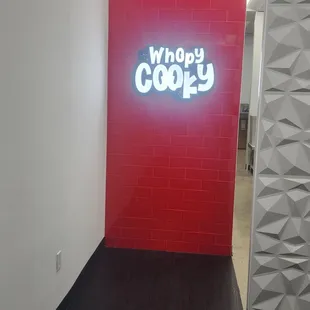 a neon sign in a hallway