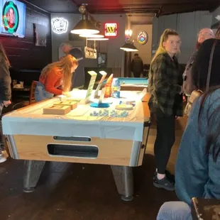 a pool table with a cake on it