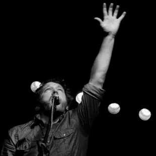 a man with his hands up in the air