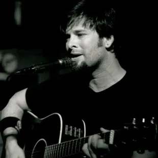 a man playing a guitar