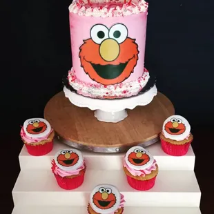 a birthday cake and cupcakes