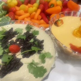a variety of vegetables and dips