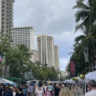 people walking down a city street