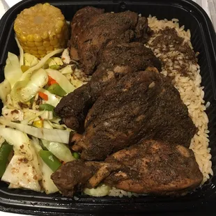 Jerk chicken with rice, veggies and corn