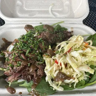 a meal in a styrofoam container