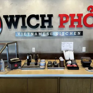 Sauce bar. Hot sauces, and fish sauces and jalapeño slices.