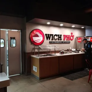 a woman standing in front of a counter