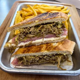 Cuban sandwich served with hot fries