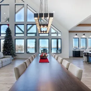 a dining room with a view of the lake