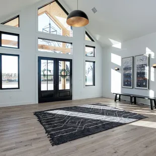 a spacious living room with high ceilings