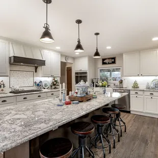 a large kitchen with a center island