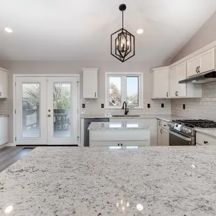 a kitchen with granite countertops