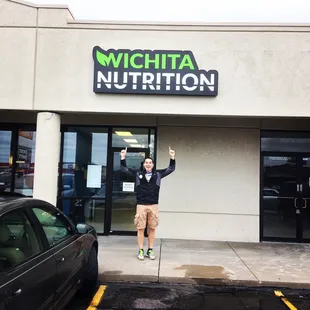 a man standing in front of a building