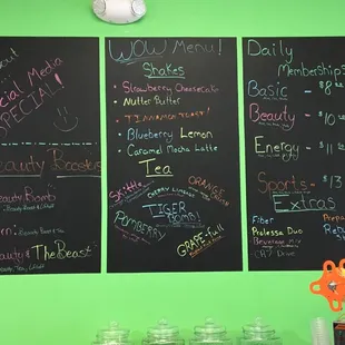 menus on a green wall