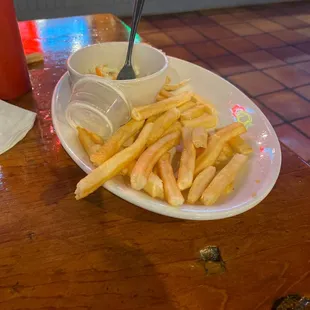 a plate of french fries and a bowl of soup