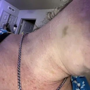 a woman with a chain around her neck