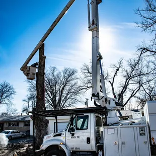 Certified Arborist Robert Phillips Running the 75ft elevator bucket truck.(Biggest in the Wichita area.)