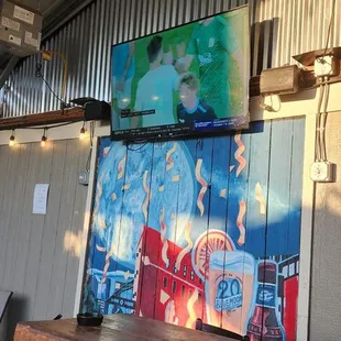 They have a TV outside, and they are showing soccer. How cool is that...