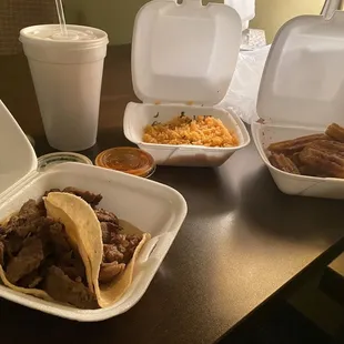 Carnitas tacos, Mexican rice, horchata and churros with sauces