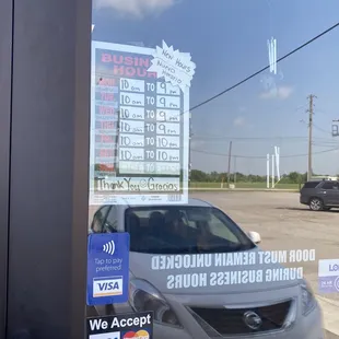 a car parked in front of a business
