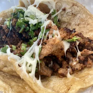 a taco with meat and cheese