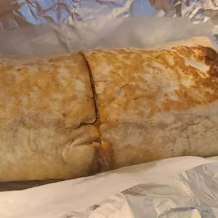 Humongous Pork Burrito is delicious. Their sauce, served separately, is fire. Use with caution.