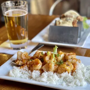 Singapore Chili Shrimp on Jasmine Rice; Buttermilk Fried Chicken Bao; Sapporo Beer on draft.