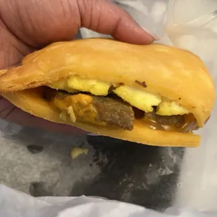 Keto sausage and egg on a flatbread (breakfast sandwich)