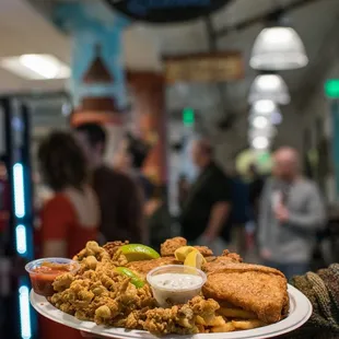 a person holding a plate of food