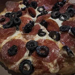 a pepperoni and olive pizza