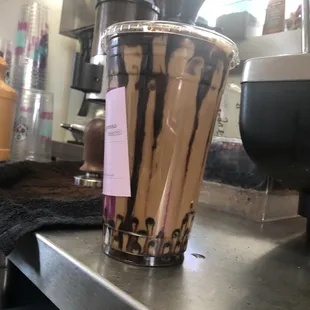Kenny&apos;s sacred iced latte with espresso shots and chocolate popping pearls!