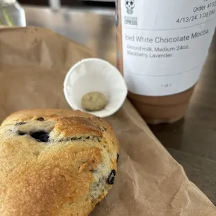 The Queen with almond milk and a warm blueberry scone