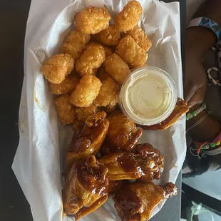 8 Kickin' Bourbon Wings with tater tots and ranch dipping sauce.