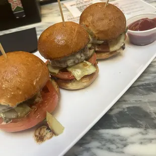 Sliders: CLASSIC BEEF american cheese, pickles, spicy ketchup