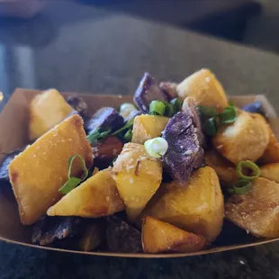a plate of potatoes and meat