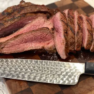 sliced steak on a cutting board