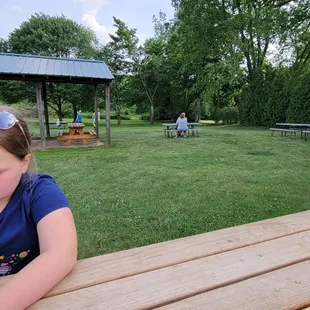 Lots of picnic tables set up to enjoy your ice cream.