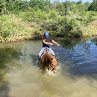 Riding through a small creek