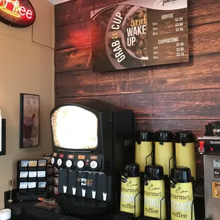a coffee machine and coffee cups