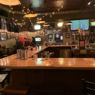 a bar with people sitting at it
