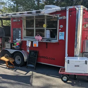 a man standing in front of a food truck