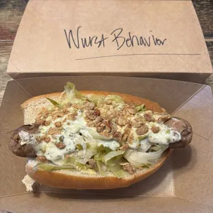 Garlic pork sausage, lemon-caper aioli, Brussels kraut, salted pretzel streusel, steamed Farm To Market white bun