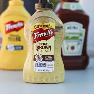 a bottle of french mustard and ketchup