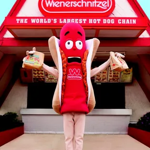 a man dressed as a hot dog