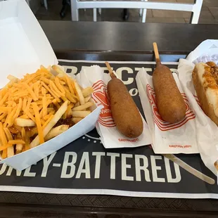 Chili cheese Fries, two corn dogs, and a Chili Cheese Dog.